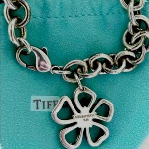 Tiffany bracelet with flower charm.